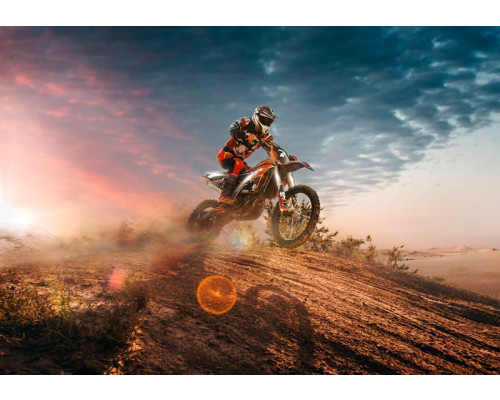 Fotobehang van motorcross met een motorcrosser in de woestijn, dynamisch en avontuurlijk.
