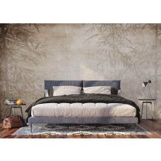 Fotobehang van bamboe in een slaapkamer, zorgt voor een rustige en harmonieuze sfeer.