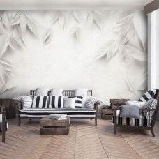 Fotobehang met ton-sur-ton bladstructuren in een moderne woonkamer.