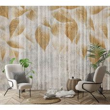 Een fotobehang van gouden bladeren op ruw beton in een woonkamer.