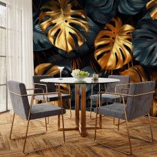 Fotobehang met gouden monstera bladeren in jungle stijl in de keuken.