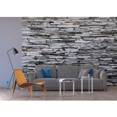 Een fotobehang van grijze stenen voor de woonkamer op vliesbehang.