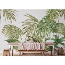 Een fotobehang met grote groene bladeren in de keuken, waarbij de tropische bladeren en natuurlijke tinten een frisse en botanische sfeer creëren.