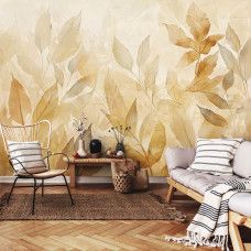 Fotobehang met vallende bladeren in warme aquareltinten in een gezellige woonkamer.