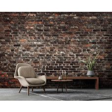 Een fotobehang van een industriėle stenen muur met urban stijl in een huiskamer.