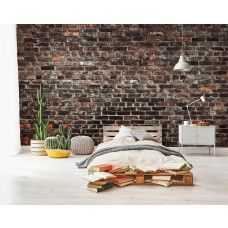 Een fotobehang van een industriėle stenen muur met urban stijl in een tienerkamer.