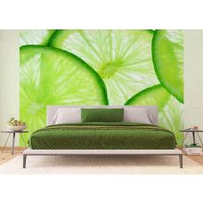 Een fotobehang van schijfjes limoenen, dat een verfrissende en levendige uitstraling geeft in een slaapkamer.