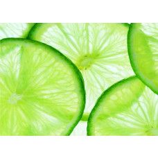 Een fotobehang van schijfjes limoenen, dat een tropische en frisse sfeer toevoegt aan elke ruimte.