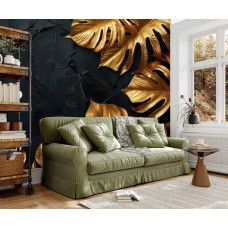 Fotobehang met botanische gouden bladeren op donkere structuur toegepast in de huiskamer.