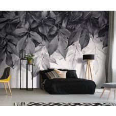 Fotobehang met minimalistische bladerenprint in een strakke slaapkamer.