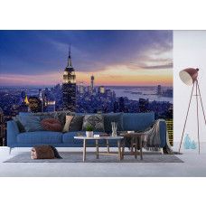 Fotobehang met een zonsondergang boven de skyline van New York in een stijlvolle woonkamer.