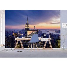 Fotobehang met een zonsondergang boven de skyline van New York in een kantoor.