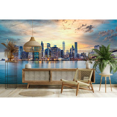 Fotobehang panorama van New York bij zonsondergang in woonkamer met brug en hoge gebouwen langs de skyline.