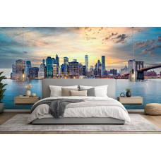 Fotobehang New York skyline bij zonsondergang panorama in slaapkamer met rustgevende kleuren en stadszicht.