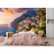 Fotobehang Positano bij zonsondergang in de slaapkamer met warme mediterrane sfeer.