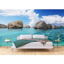Een fotobehang van rotsen in de zee, blauw voor de slaapkamer.