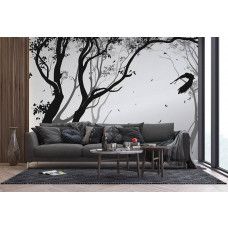 Een fotobehang van een silhouet van een bos met een vogel in de wind in een woonkamer met vliesbehang.