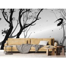 Een fotobehang van een silhouet van een bos met een vogel in de wind in een woonkamer.
