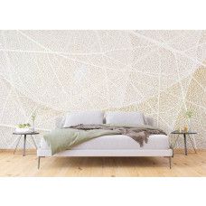 Een fotobehang van de structuur van bladeren in een slaapkamer.