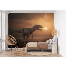 Fotobehang T-Rex in de avondzon in een kinderkamer met een machtige dinosaurus tegen een oranje lucht.