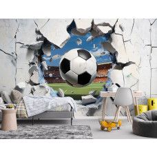 Fotobehang Voetbal door de Muur in een kinderkamer, waar het 3D-effect van de doorbrekende bal zorgt voor een stoere en sportieve sfeer.