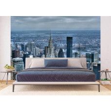 Een fotobehang van wolkenkrabbers in de skyline van New York in een slaapkamer.