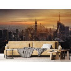 Fotobehang met een magische zonsondergang boven de wolkenkrabbers van de New York skyline, gepresenteerd in de woonkamer.