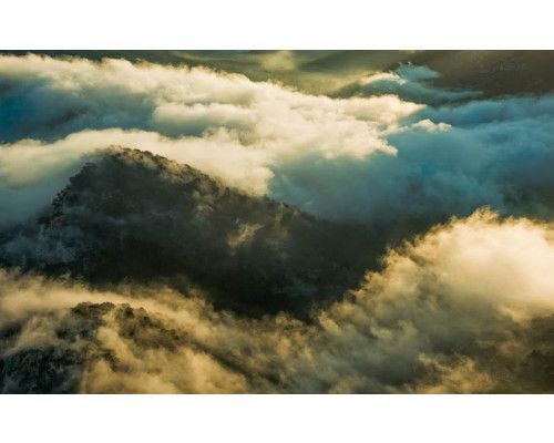 Cap de Formentor fotobehang met wolken en uitzicht op Mallorca.