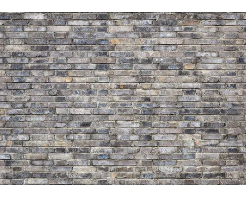 Fotobehang van een grijze stenen muur met industriële uitstraling.