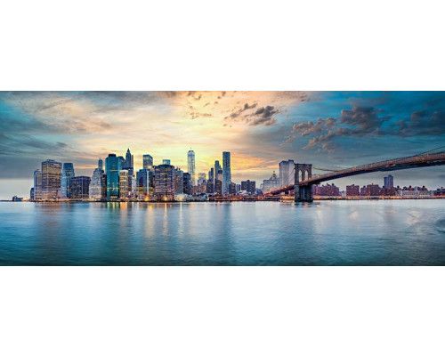 Fotobehang Strand met Duinen en Zee met uitzicht over zand, helmgras en glinsterende golven.