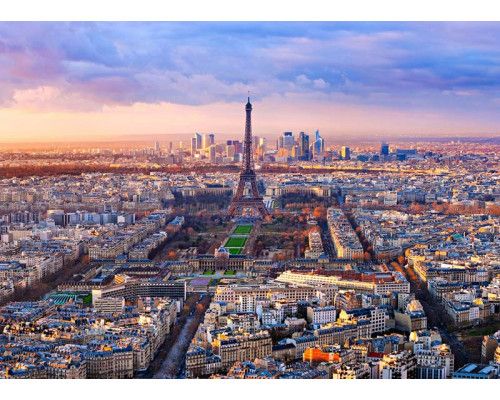 Fotobehang van een zonsondergang in Parijs met de Eiffeltoren.