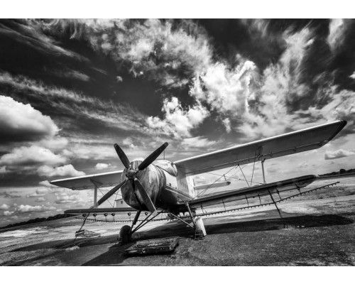 Fotobehang van een zwart-wit vliegtuig, minimalistisch design.