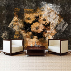 Een 3D-fotobehang van gouden bloemen tegen een betonnen muur te zien in de woonkamer.