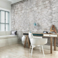 Een fotobehang met een betonnen muur in industriėle stijl voor de woonkamer.