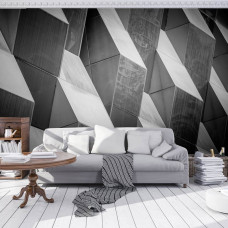 Een fotobehang met een 3D-patroon en geometrisch effect te zien in de woonkamer.