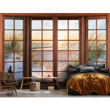 Een fotobehang met 3D-raamzicht op de duinen, strand en zee bij zonsondergang in een serene slaapkamer.