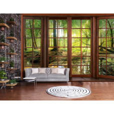 Een fotobehang met 3D-raamzicht op een zonnig boslandschap in een moderne woonkamer.