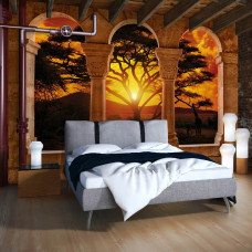 Een fotobehang met een 3D-weergave van een Afrikaans landschap met pilaren, perfect voor een slaapkamer.