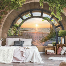 Een fotobehang met een 3D-weergave van een strandlandschap bij zonsondergang, ideaal voor een kinderkamer.