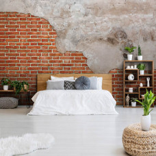 Een industrieel fotobehang van een rode bakstenen muur met betonelementen te zien in de slaapkamer.