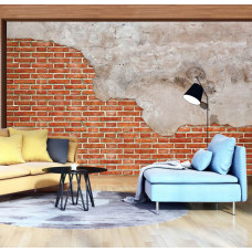 Een industrieel fotobehang van een rode bakstenen muur met betonelementen te zien in de woonkamer.