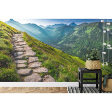 Een fotobehang met een kronkelend bergpad langs indrukwekkende bergtoppen, ideaal voor een keuken.