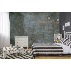 Een fotobehang met een industriėle betonnen muur voor de slaapkamer.