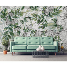 Een fotobehang met bladeren op een betonnen muur en planten te zien in de woonkamer.