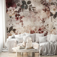 Een fotobehang met bordeauxrode bloemen op beton, perfect voor een slaapkamer.