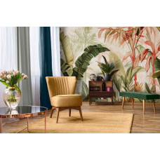 Een fotobehang met botanische jungle bladeren op beton in een natuurlijk ontwerp, passend in een woonkamer.
