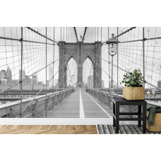 Een fotobehang met een artistieke weergave van de Brooklyn Bridge, afgebeeld in een slaapkamer.