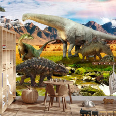 Een fotobehang met dinosaurussen bij een kalme rivier, afgebeeld in een jongenskamer.