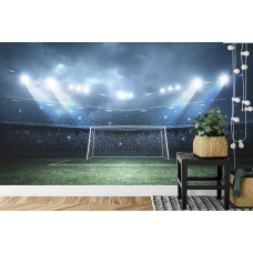 Een fotobehang met een voetbal gericht op het doel in een stadion in een kinderkamer.