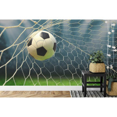 Een fotobehang met een spannend voetbalmoment in een kinderkamer, gericht op het doel.